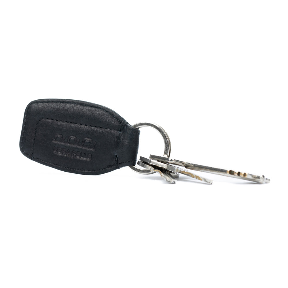 K10753AB | Genuine full-grain leather key ring, with light grain. Black color. Polished Nickel Ring. Total dimensions: 3.5 x 9 x 0.5 cm. Packaging: hard bottom/cover Gift Box                             Porte-clés en cuir pleine fleur véritable, grain
