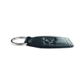 K10753AB | Genuine full-grain leather key ring, with light grain. Black color. Polished Nickel Ring. Total dimensions: 3.5 x 9 x 0.5 cm. Packaging: hard bottom/cover Gift Box                             Porte-clés en cuir pleine fleur véritable, grain